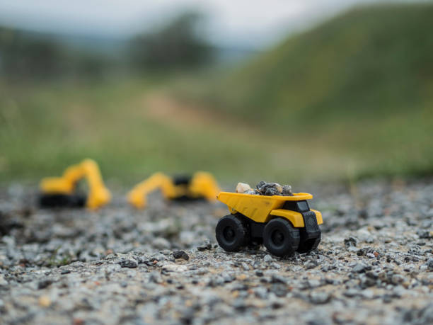 istock Toy construction machinery working on an excavation 1224154669