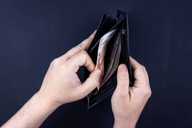 istock wallet with money in hand 1224154898