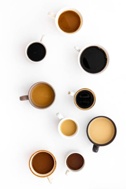 istock Cups of hot drinks on white desk top view 1224155561