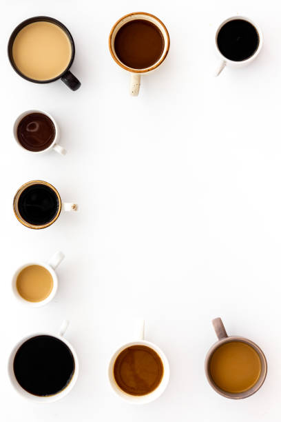 istock Cups of hot drinks on white background from above frame copy space 1224155617