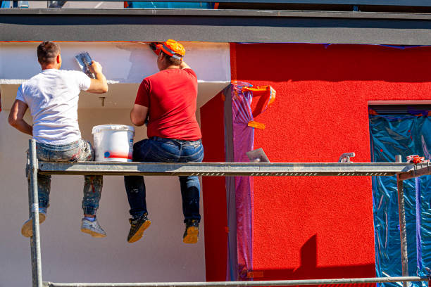 istock Construction workers plaster the facade of the building. 1224156154