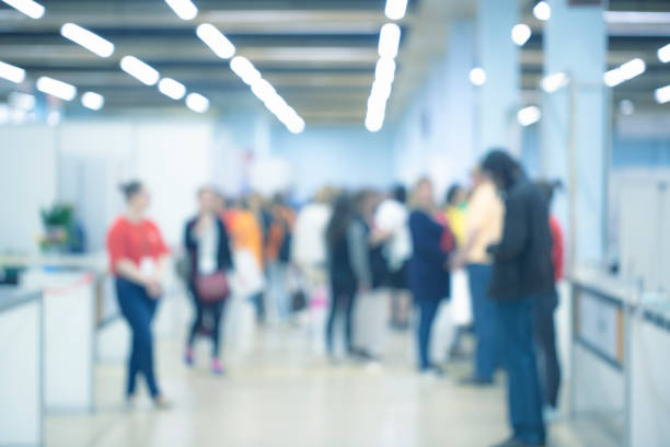 istock Abstract blurred people walking in shop 1224156477