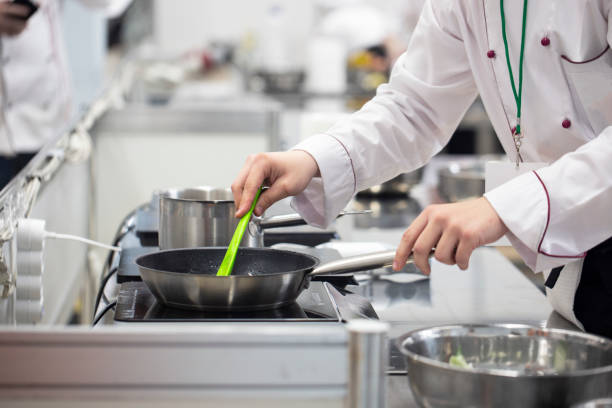 istock Cook preparing food in a restaurant kitchen 1224156498
