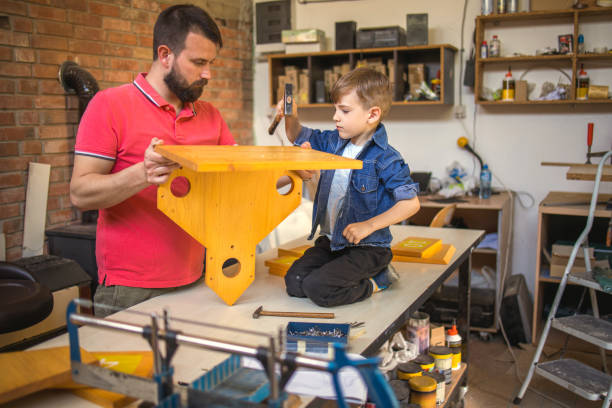 istock Father and Son Making a Birdhouse 1224157191