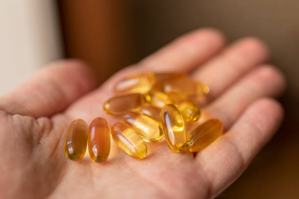 istock A handful of vitamin d capsules is in a man's hand. 1224157549