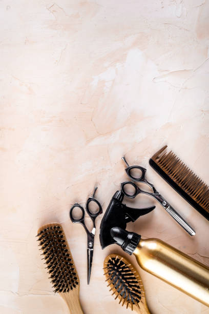 istock Hairdressing instruments. Combs, scissors and spray on beige desk from above frame space for text 1224160268