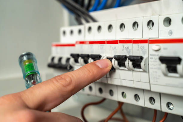 istock Electrician switching off electric fuse 1224160385