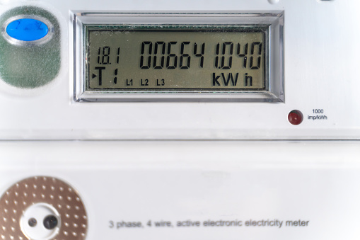 Close-up electric meter figures. Control of power consumption. Topic of tariff increases..