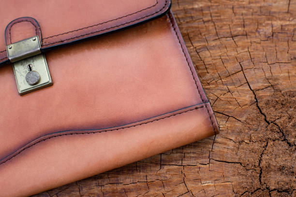 istock Close up Brown leather wallet on wood texture. 1224162004