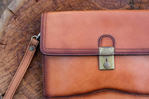 istock Close up Brown leather wallet on wood texture. 1224162060