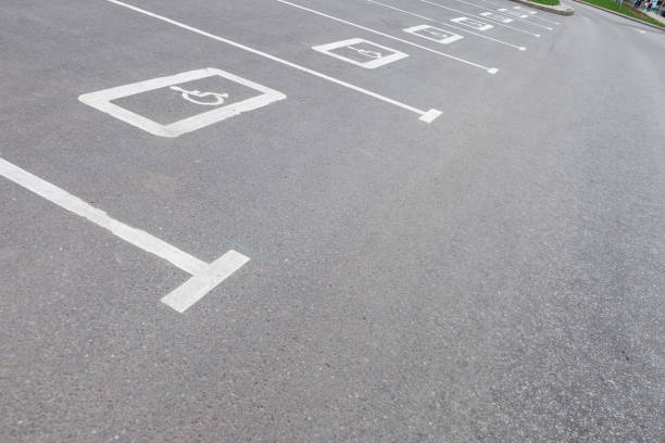 istock Parking space for the disabled. white sign for disabled Parking space on the asphalt. Handicapped parking spot 1224163496