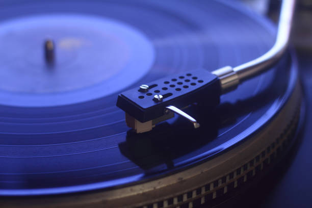 istock old vinyl record with clipping path. DJ Turntable with Vinyl Record, Playing, Top View. Close up at the needle on turntable 1224165574