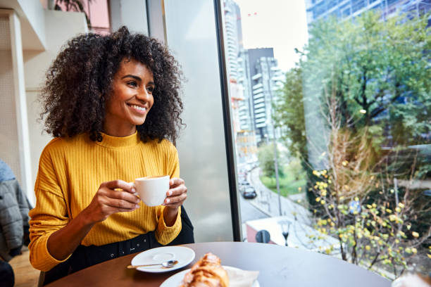 istock African female having a break at coffee shop. 1224166464