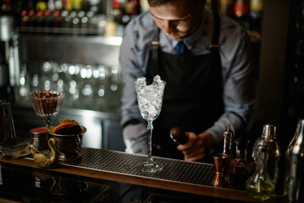 istock transparent glass with ice standing on bar counter. 1224166909