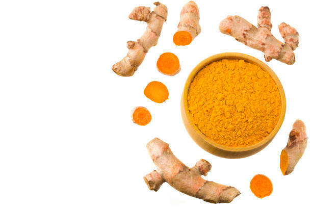 istock Turmeric powder with turmeric root isolated on white background. Top view. 1224167341