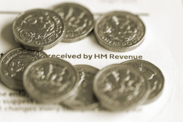 istock Pound coins on a tax form 1224168439
