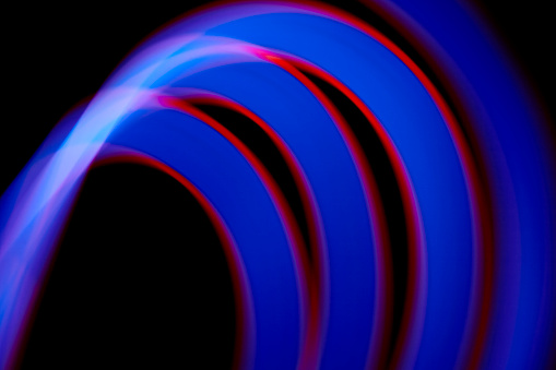 Abstract blue and red light trail painting background