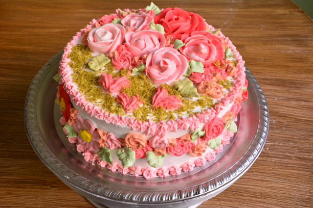 istock cake with whipped cream and royal icing roses 1224172494
