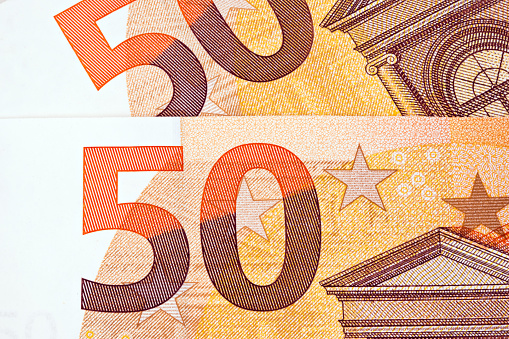 Fragment of a ten euro banknote close-up with denomination.