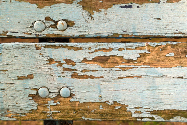 Baby blue colored wooden bench texture with old peeling paint