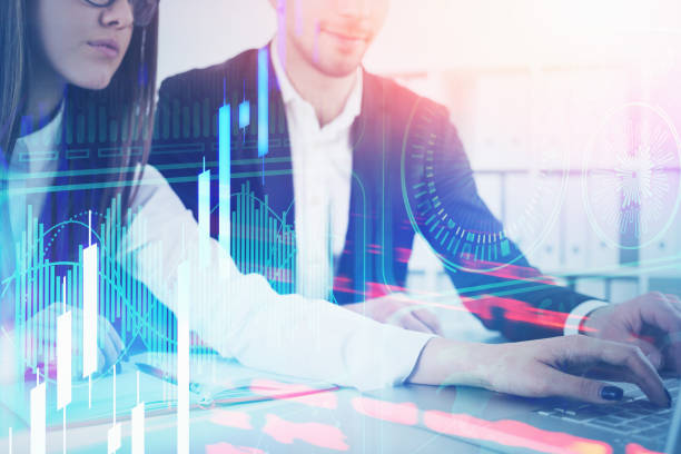 istock Man and woman in office, digital graph 1224174323