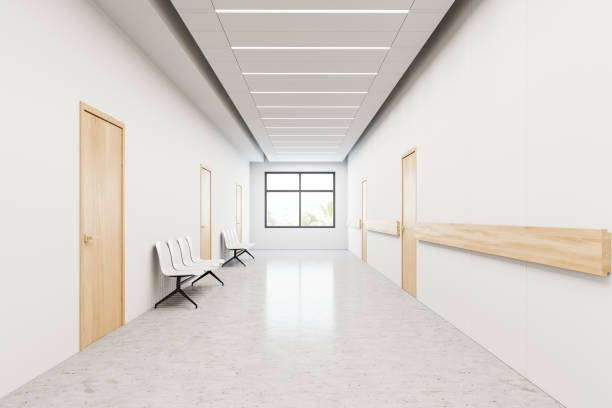 istock Chairs in hospital corridor with doors 1224175599