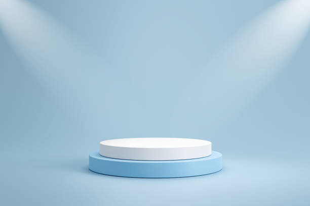 istock Studio template and white round shape pedestal on light blue background with spotlight product shelf. Blank studio podium for product advertising. 3D rendering. 1224176506