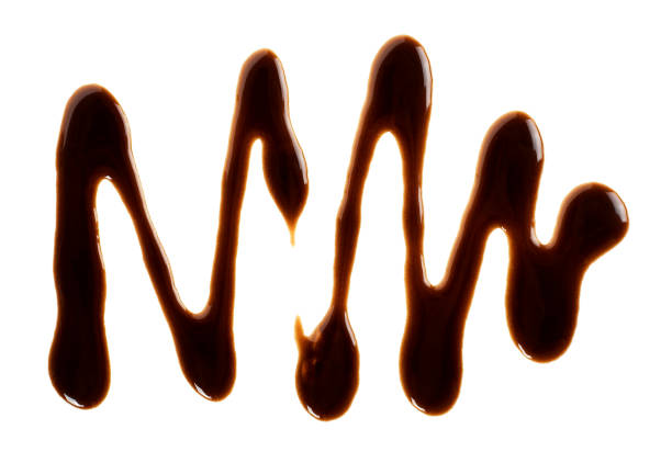 istock Sweet chocolate sauce isolated on a white background. Chocolate syrup drop. 1224180292