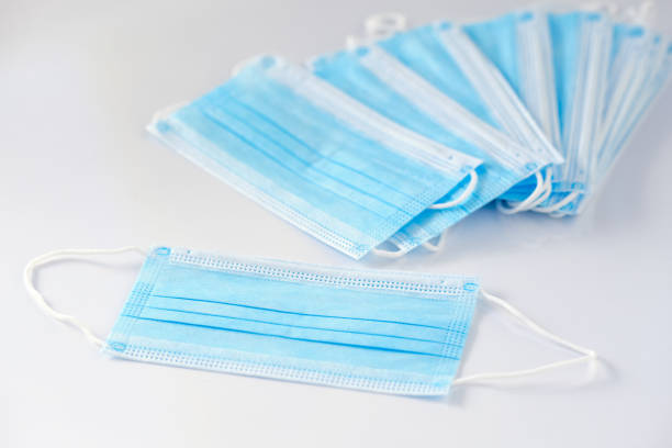 istock Stack of new disposable face masks on white background 1224182034