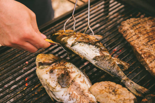 istock cooking fish and potatoes on grill 1224182166