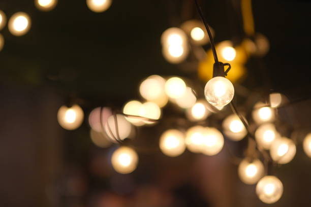 istock close up many shiny light bulbs at dark night. beautiful bokeh background 1224183780