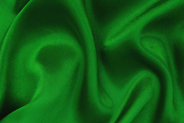 istock Dark green fabric cloth texture for background and design art work, beautiful crumpled pattern of silk or linen. 1224184890