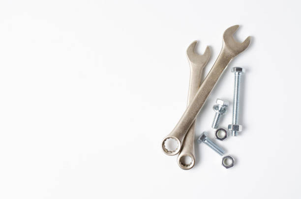 istock Wrench and bolts with nuts. White background. Copy space 1224184978