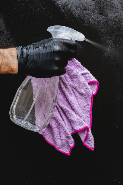 istock Man cleaning with cleaning spray. 1224186414
