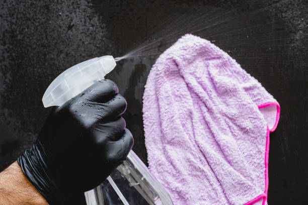 istock Man cleaning with cleaning spray. 1224186460