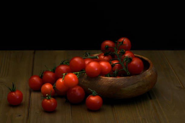 istock Fresh red tomatillos on black 1224194677