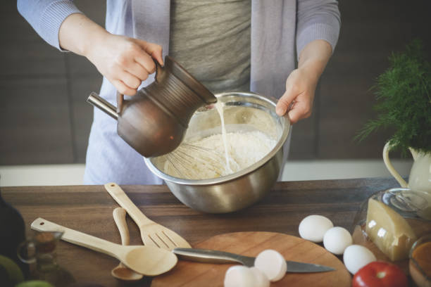 istock woman in the kitchen preparing food 1224195992