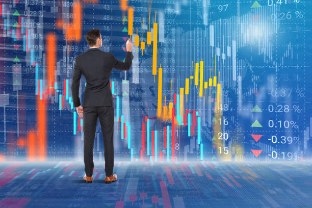 istock Businessman analyzing data in front of stock market virtual interface 1224196107