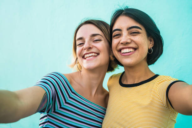 istock Lovely lesbian couple taking a selfie. 1224196822