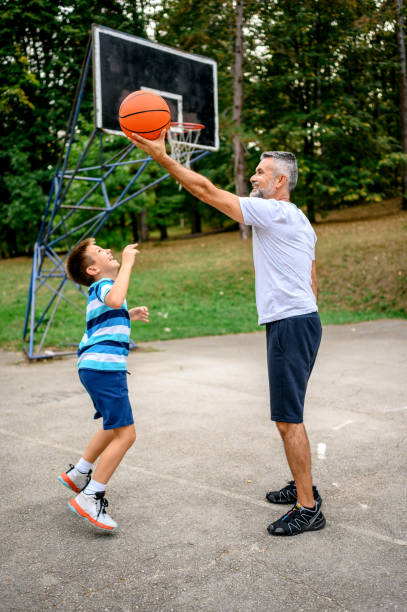 istock Father and son playing basketball 1224196829
