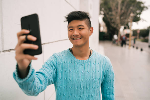 istock Asian man taking a selfie with his mobile phone. 1224196844