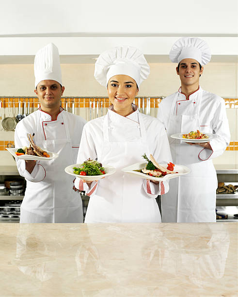 istock Chefs Holding Plates of Food 122419792