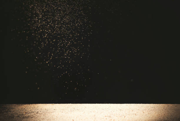 istock white table with bright shiny sparkles isolated on black 1224198763