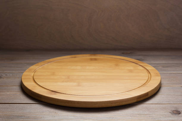 istock pizza cutting board at rustic wooden table plank background 1224199628