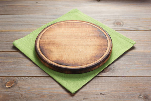 istock pizza cutting board at rustic wooden table plank background 1224200155