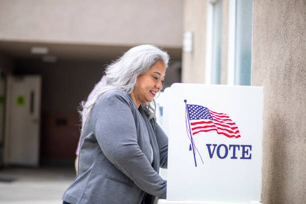 istock Senior Mexican Woman Voting 1224201109