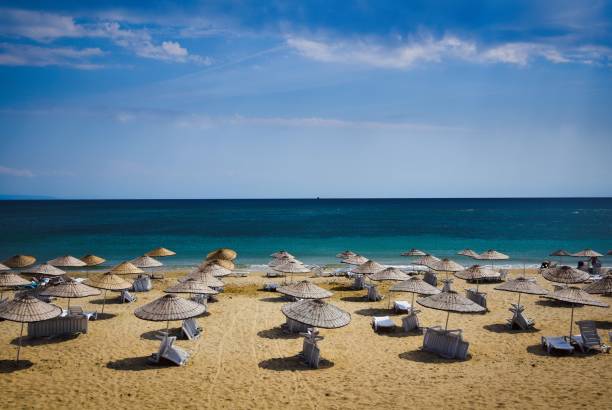 istock The Beach with Sunnny , Blue sky , Parasols and Sands 1224201254