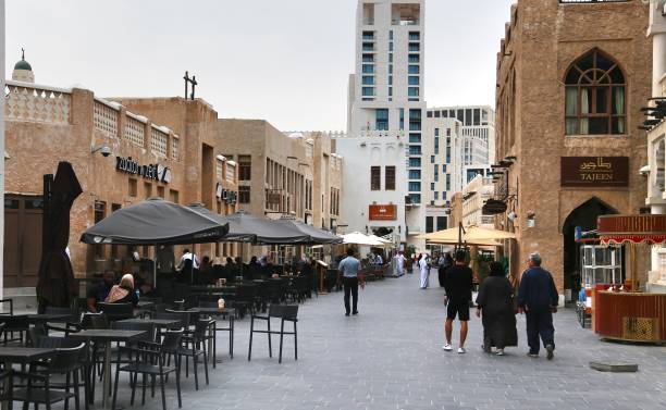 Many people walking at Souq Waqif is a marketplace in Doha of Qatar stock photo