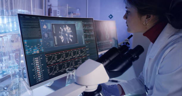 istock Young female microbiologist studying coronavirus. Futuristic lab 1224202468