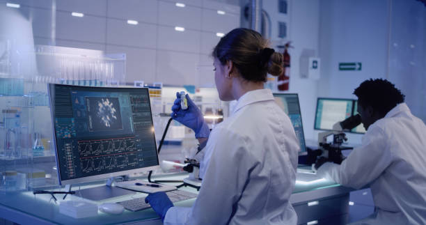 istock Multi ethnic research team studying DNA mutations. Female doctor in foreground 1224202530
